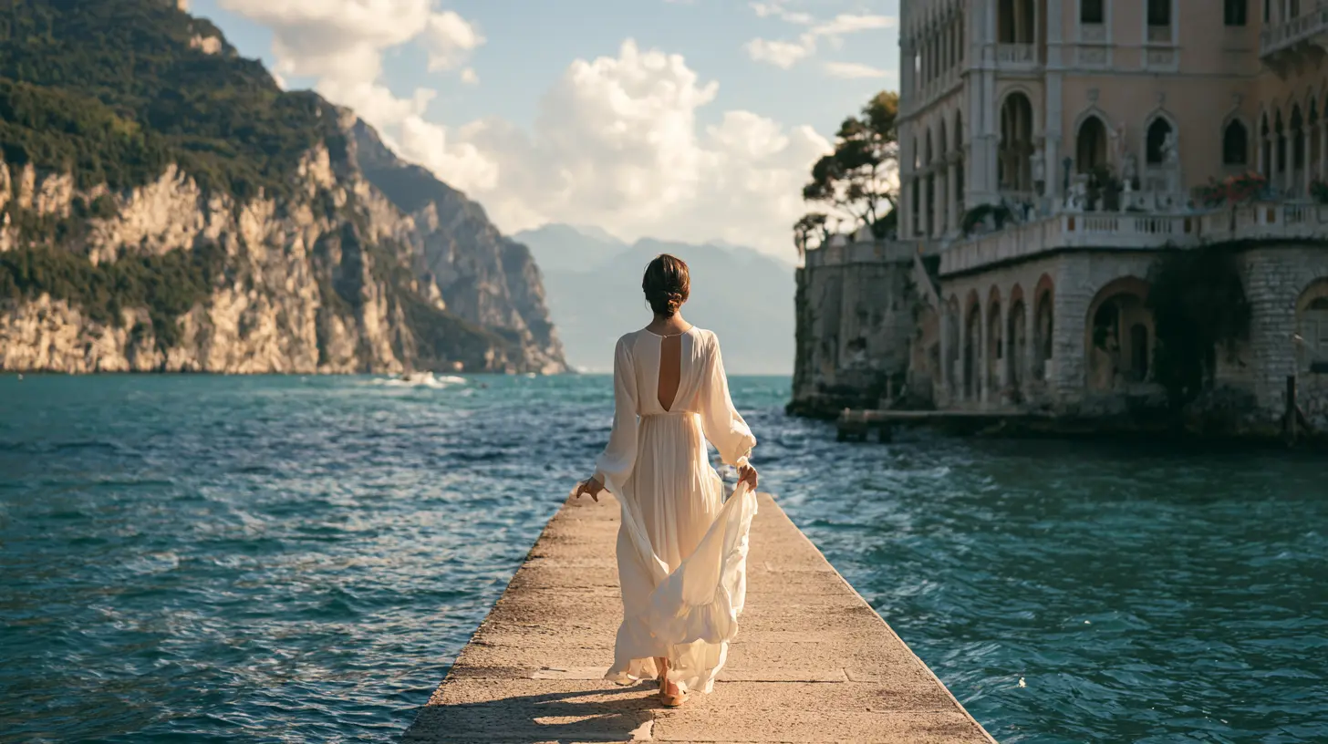 Traveller on a stone pier beside a lakeside palazzo